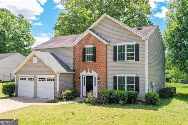 view of front of property with a garage and a front yard