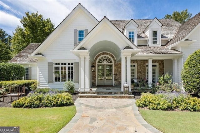 doorway to property featuring a yard