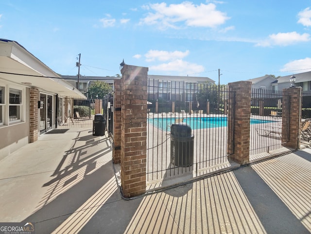 view of swimming pool featuring a patio area