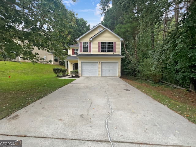 view of front facade with a garage and a front yard