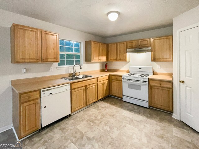 kitchen with sink and white appliances