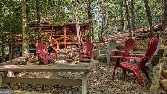 wooden deck with a fire pit