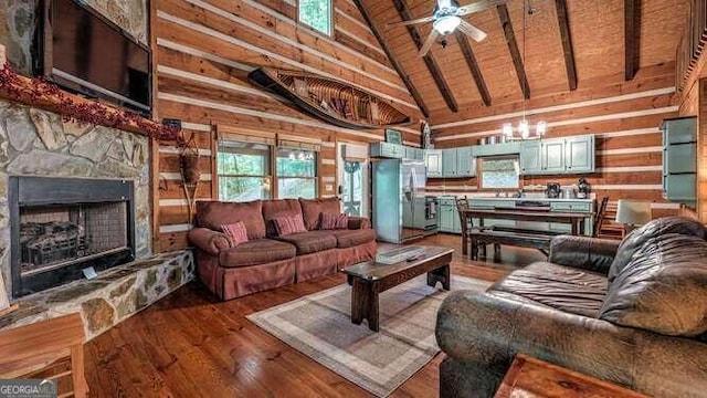 living room with a fireplace, high vaulted ceiling, wood walls, wood-type flooring, and ceiling fan