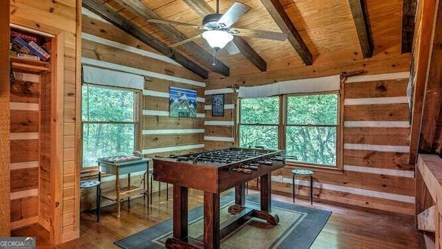 playroom with wooden ceiling, wood-type flooring, ceiling fan, and vaulted ceiling with beams