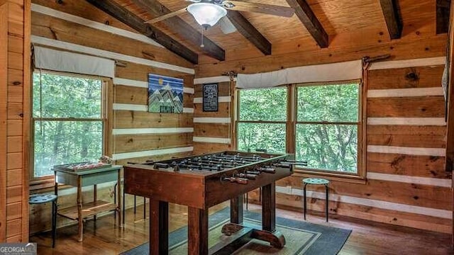 rec room with lofted ceiling with beams, hardwood / wood-style flooring, ceiling fan, and wood ceiling