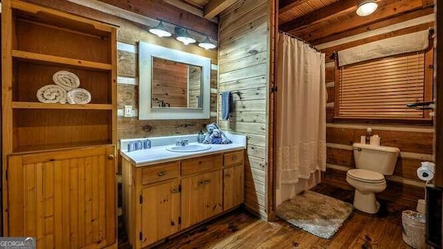 full bathroom featuring vanity, toilet, wood-type flooring, and shower / tub combo