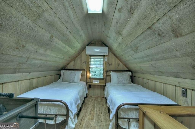 bedroom with a wall unit AC, wooden ceiling, vaulted ceiling, light hardwood / wood-style floors, and wood walls