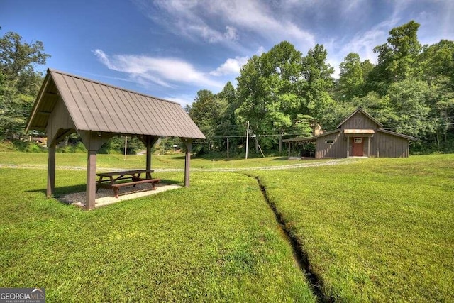 exterior space featuring a yard and a gazebo