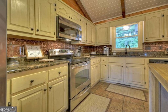 kitchen featuring stainless steel appliances, sink, wooden ceiling, lofted ceiling, and light tile patterned flooring