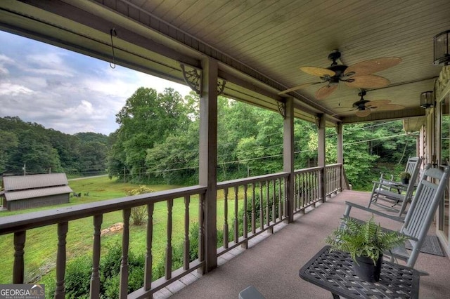 exterior space featuring a porch and ceiling fan