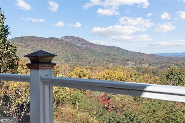 view of mountain feature with a forest view