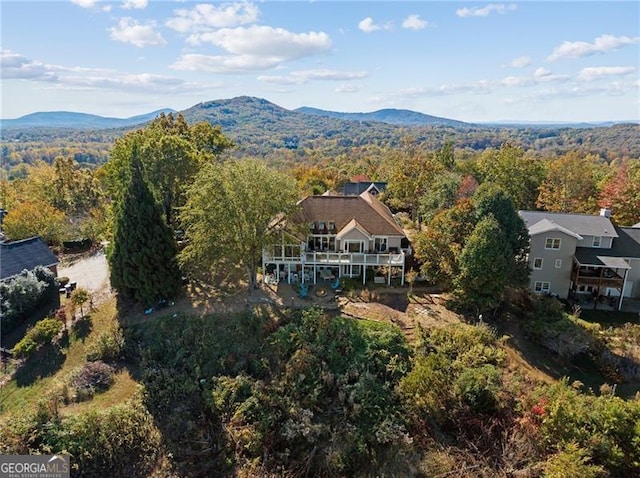 bird's eye view featuring a mountain view and a view of trees