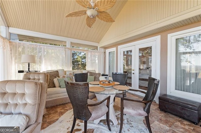 sunroom / solarium featuring french doors, lofted ceiling, and ceiling fan