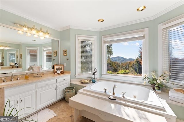 bathroom with a tub to relax in, vanity, plenty of natural light, and tile patterned floors