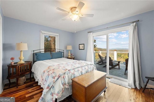 bedroom with light wood-style flooring, access to exterior, and a ceiling fan