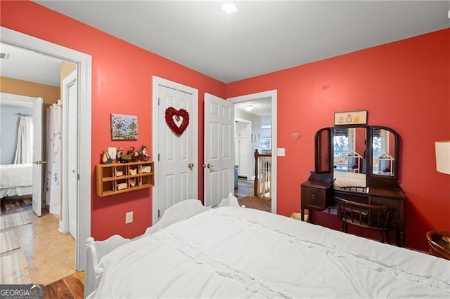 bedroom featuring light tile patterned floors