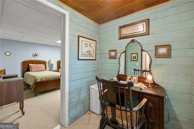 interior space with wood walls and tile patterned flooring