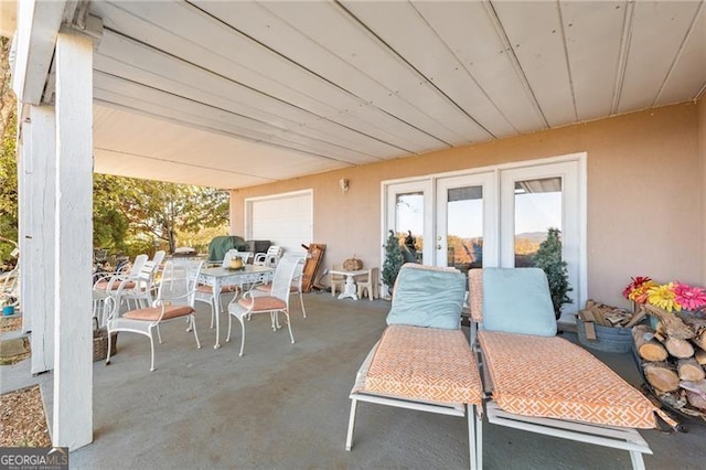 view of patio / terrace with outdoor dining space and french doors