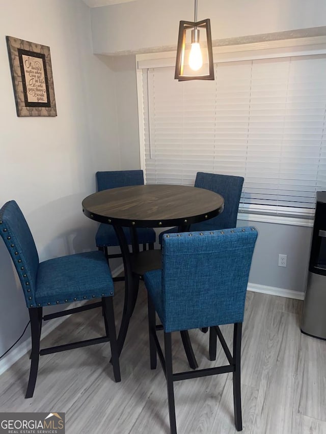 dining room featuring wood-type flooring