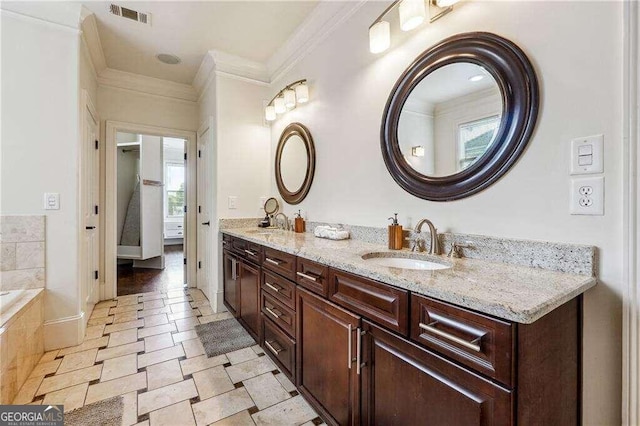 bathroom with crown molding, vanity, and a relaxing tiled tub