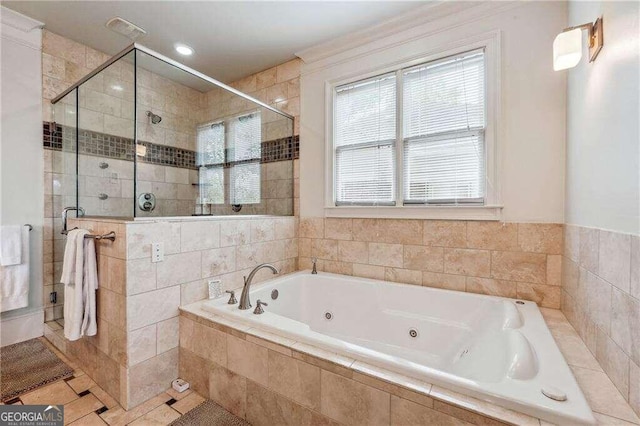 bathroom featuring plus walk in shower and tile patterned flooring