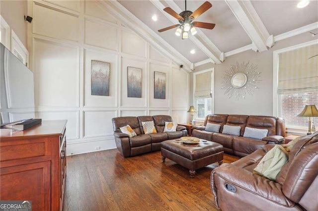 living room with crown molding, lofted ceiling with beams, dark hardwood / wood-style flooring, and ceiling fan