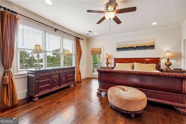 bedroom with crown molding, ceiling fan, and dark hardwood / wood-style flooring