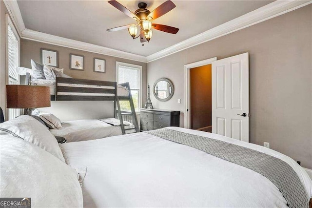 bedroom featuring ornamental molding and ceiling fan