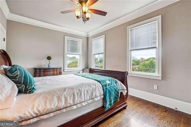 bedroom with ceiling fan, ornamental molding, and hardwood / wood-style floors