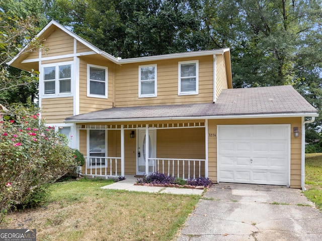 view of front property with a porch and a garage