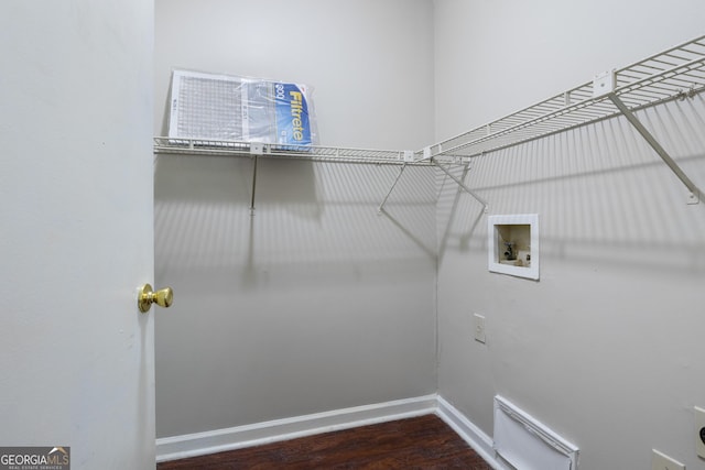 clothes washing area featuring hookup for a washing machine and dark hardwood / wood-style floors