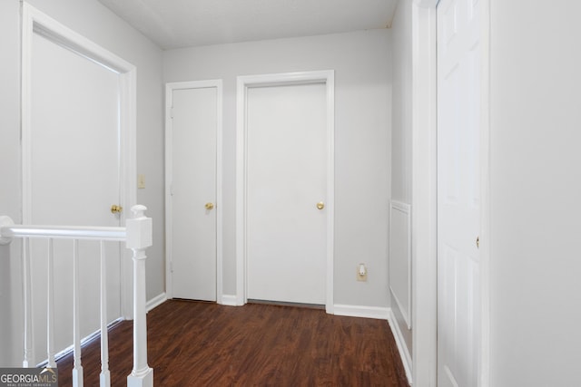 hallway featuring dark hardwood / wood-style flooring