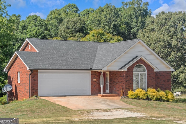 view of front of house featuring an attached garage, brick siding, driveway, a shingled roof, and a front yard
