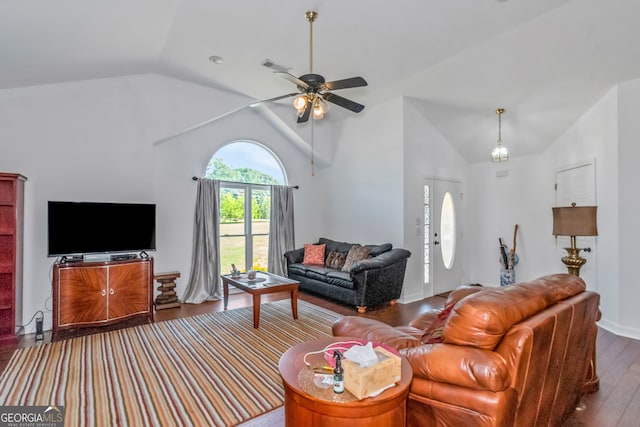 living room featuring lofted ceiling, ceiling fan, and wood-type flooring