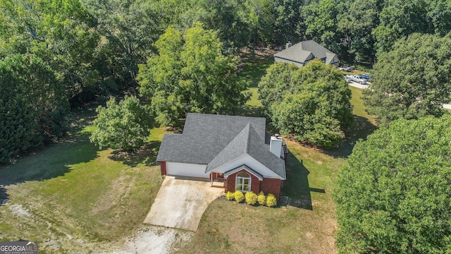 view from above of property featuring a heavily wooded area