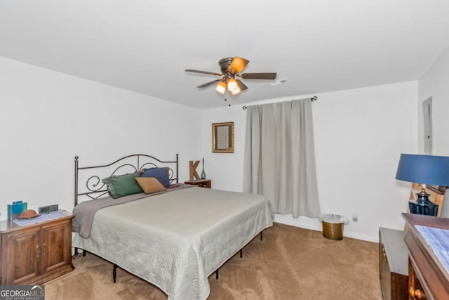 bedroom featuring carpet floors, baseboards, and a ceiling fan