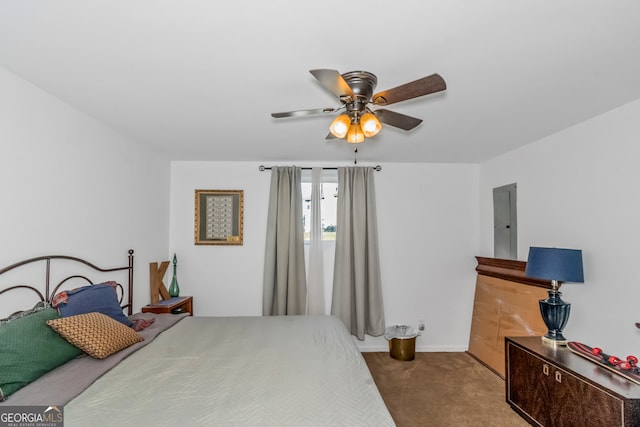 bedroom featuring ceiling fan and carpet