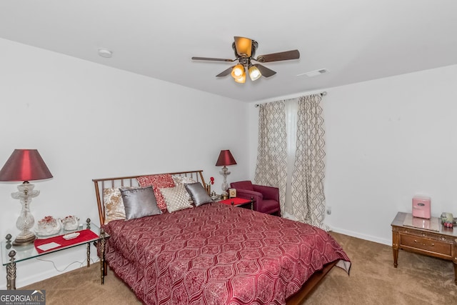 carpeted bedroom with baseboards and ceiling fan