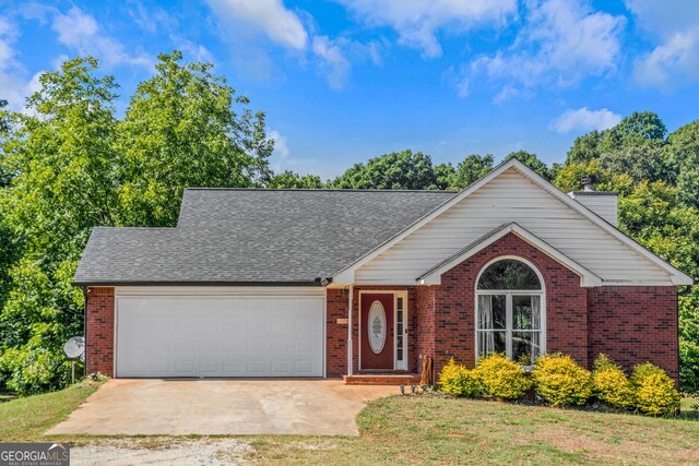 825 S Bethany Rd, Locust Grove, GA 30248 - view of front of property with brick siding, a garage, concrete driveway, and a chimney