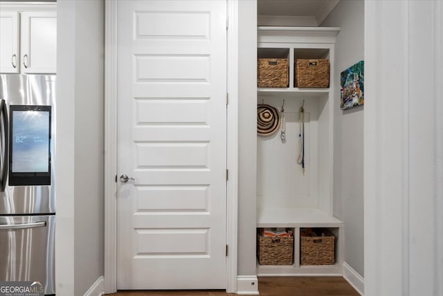 mudroom featuring crown molding and wood-type flooring