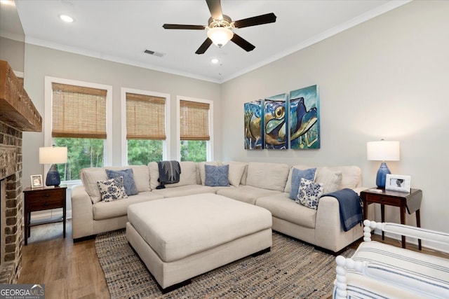 living room with ornamental molding, a wealth of natural light, hardwood / wood-style floors, and ceiling fan