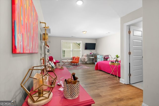 game room featuring hardwood / wood-style floors