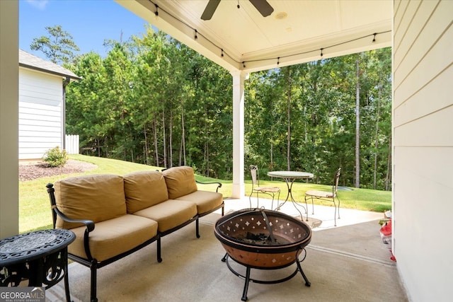 view of patio featuring an outdoor living space with a fire pit and ceiling fan