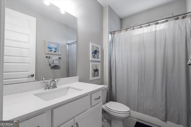 bathroom with vanity, toilet, and walk in shower