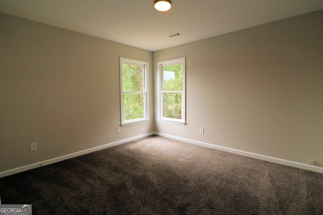 unfurnished room featuring carpet flooring