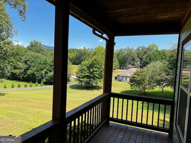 deck featuring a lawn