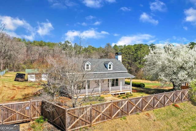 rear view of property featuring a porch