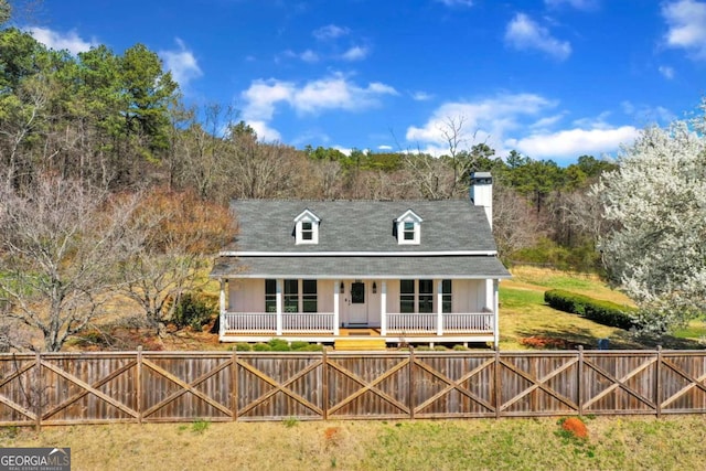 back of house featuring a porch