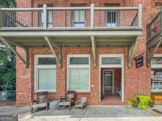 doorway to property featuring a balcony