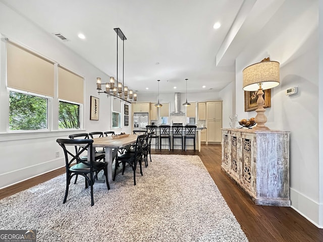 dining area featuring dark wood-type flooring